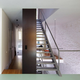 Illustration for article titled This Dream House Was Entirely Built Around a Giant Three-Story-High Bookshelf